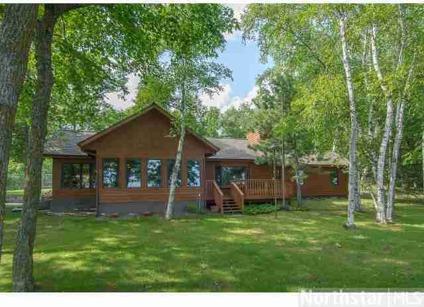 $675,000
Big Pine Lake acreage and 469' of hard sand frontage! Main home Two BR/Two BA/