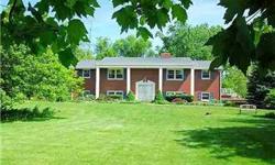 Over 5 acres. Big shade trees, flowering trees and shrubs. A true bi-level. Family room, den and bedroom on the lower level. Knotty pine throughout the lower level. Circular staircase to the 2nd level. Huge formal living room, dining room. Large breakfast