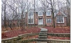 Gorgeous custom home nestled in mature trees in exclusive Butternut. Impressive 2 story foyer w/marble flr. Open floor plan. Dramatic 2 story family rm w/stone fireplace, sun room, enormous kitchen, main lvl bdr & main lvl study, laundry w frig. Custom