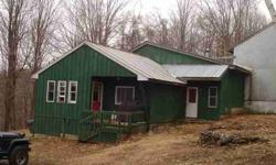 Why rent when you can own this 3 bedroom home on 5.20 acres and lots of wildlife. This homes is located on a dead end road and is very private. Nice open kitchen to the dining room. Knotty pine family room. For all those toys and projects, there's an