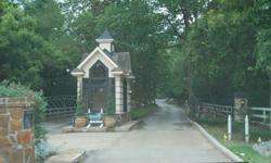 lOT LOCATED IN GATED DISTINQUISHED TEASWOOD SUB IN CONROE TEXAS. 1+ ACRE SERENE UNSPOILED BEAUTY SURROUNDED BY BEAUTIFUL HOMES. PUBLIC WATER AND SEWER, NO BUILDING DEADLINE