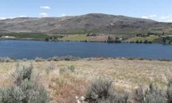 Affordable 7.86 ac. Vacation Retreat! Sunshine over 300 days a year. Views of the Columbia River, Mountains & Orchards for miles. Recreation Galore. Fish Salmon & Steelhead. The Okanogan & Methow Rivers Very Close by. Game Hunting. Boating, Skiing, Jet