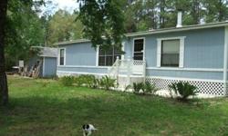 Spend your winters on your own land in North Central Florida,,Or live here year round.5 secluded acres in the woods. A spring fed creek running through the property.Well maintained 1300sq ft plus, double wide, mobile home with 3 bedrooms, 2 full