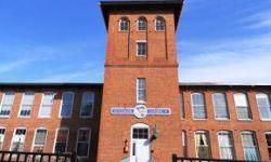 Gorgeous sunny END UNIT on the 3rd floor in this historic conversion building located on the Lamprey just steps to Newmarket cafes, post office, bank, UNH & Portsmouth bus lines. Exposed beams, brick walls, over sized windows, hard wood floors, newer