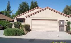 Rare find in Cougar Place 1 right across from the highly acclaimed Clovis High. This is a highly desirable large 2 bed 2 bath with 2 car attached garage. It also features a wet bar off the dining area, fireplace and indoor laundry. This is a Fannie Mae