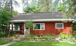 This wonderful home is centrally located on a peaceful, private lot within walking distance of schools, shopping, and EWU. The spacious kitchen has tile floors and a cozy breakfast nook that looks out over the patio and beautiful gardens. The master suite