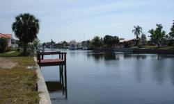 109 Colonial Street, Port Charlotte FL - large boats & sailboats! Deep water canal waterfront lot with dock and electrical, land cleared to build. This is fast growing area of waterfront homes, only a few minutes to the gulf. Asking $150K by owner. Call