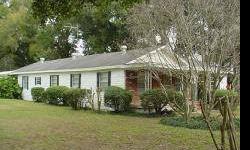 Old Florida living, Country house sits in east corner of this square 7 acres. House wiring and plumbing has been updated. Bring the paint and carpaet along with your buyers ideas and this will be a real treasure. 2nd septic and power pole for 2nd