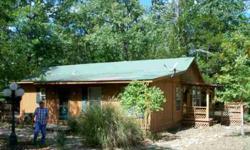 This 3 bedroom, 2 bath home has a huge, mostly covered, wrap-around deck. It comes with a stove, refrigerator, washer, dryer and more. Nice 30x50 shop with wood heat, water and electricity. All on approximately 97 acres of the best deer and turkey hunting