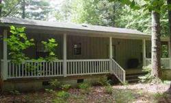 Secluded and private, yet just off paved road. This mountain cabin has seen very little use over the years. Full width covered porches are on the front and back of home. A new dishwasher and range are being installed. Carpet is like new. Heat pump for