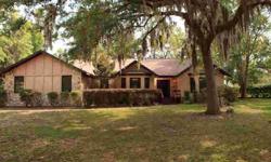 This home is situated on a corner lot and nestled in the tranquil and well-groomed neighborhood of Sandlin Woods in the area of Golden Hills and Golden Ocala. Interior features