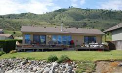 Excellent home with prime waterfront on Lake Chelan. Nice size dock, sandy beach, protective cove, decks on both front and back of house. Roomy inside with great views of Lake Chelan and surrounding mountains. Enjoy the good life in Chelan for all the