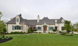 Exquisite French Country manor in gated community. Featured in the 2007 Home-A-Rama, this homes boasts a stunning exterior, surrounded by a trio of courtyards complete with a koi pond and private access to the Monon Trail. Inside you will find a