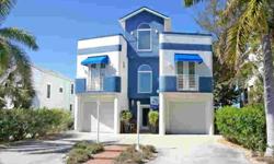 This property is located by the azure, lapping waters of the Gulf of Mexico in the quiet residential area of Sunset Beach in Treasure Island, Florida. This custom home boasts many outdoor areas. A cantilevered terrace on the second floor is adjacent to