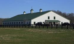 Amazing horse farm minutes to Leipers Fork/Franklin,+-2000 sq home inside this 20 stall horse barn,4 board black fence,large riding arena,run in sheds,level pasture,breathtaking views,river runs at back of the property,automatic watering system in