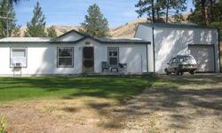 Nicely treed acreage with a 3 bedroom, 2 bathroom, 2 car garage home. Corral Creek Ranch plat. Located less than 10 minutes from downtown Chelan, so quite convenient to everything , as well. Large 24 x 40 garage/shop has the potential to add mother-in-law