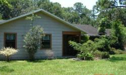 Very private and secluded 7 acres (wire fenced) with 1988 custom built home with nice floor plan, 24x15 workshop. Property adjoins Country Club of Ocala. Formal living and dining rooms, kitchen has all appliances included, breakfast bar adjoins Family