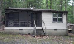 Handyman Special. This home is being sold as is. It could be returned to it's adorable self with a some help from your contractor. Originally one bedroom, but half the porch was enclosed at some time to make a second bedroom. Wood floors under carpeting.