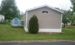 How would you like to live close to the Dells and Circus World, well this might just be just the place for you?Here is a mobile home in a great quite community close to everything. It is a 2 bedroom 2 full baths. Large eat-in kitchen, and a large living