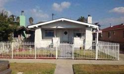 Great classic california home with welcoming covered porch and gated front yard.