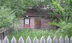 Old log cabin that has one room plus a bath. Would be vacation spot or hunting cabin. Bathroom has been added. Cabin is just log and chinked with no insulation. Rough flooring in one room. Old shed included with old trees on lot.Listing originally posted