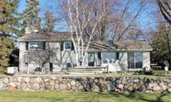 Stunningly well maintained and highly upgraded lake home on scenic Third Lake. Fantastic floor plan, beautiful kitchen with furniture grade cabinetry & granite counters. Adjoining eating area with awesome lake views. Stoned faced woodburning fireplace for