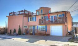 Stunning Ocean Front Contemporary Beach House!! Open & Inviting floor plan with hardwood floors thru out! Gourmet Kitchen, Living Room, Dining Room, Den/Family Room, 3 Bedrooms, 3.5Baths, handicap access with elevator and ramp. Roof Top Deck, garage,