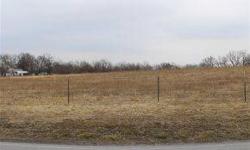 Beautiful pasture with several building sites on paved Co Rd. Mobile home Doesn't convey.
