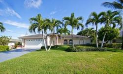 located south of Cape Coral Parkway close to Cape Harbor, unrestricted, direct sailboat access, minutes to the Gulf of Mexico. Home is move in ready and features large pocketing sliding glass doors, open floorplan, high ceilings. A large Pool area with a