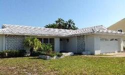 Lowest price house on Island Estates! Don't miss this opportunity to live in a cozy 2 bedroom 2 bath home with sliders opening to covered patio and pool. Fresh paint updated kitchen and baths, terrazzo tile and split floor plan, very cute! Pool and large