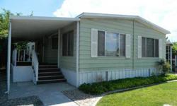 2 bedroom, 2 bath mobile home located in Highlands Sr park. Spacious living room and dining room. Rounded kitchen with window to the covered patio. Laundry room with washer and dryer hook-ups. Family room off of the kitchen with a wood stove and a sliding