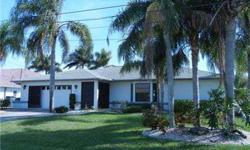 Beautiful Cape Coral Waterfront Property! If you are looking for an absolute, move-in condition home...You have found it! Yes the home is a bit older but as clean as new! Beautiful, deep water pool, extra wide canal with Gulf Access, boat dock/lift, sunde