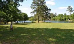 LOT IS NESLTED IN WINDMILL ESTATE.VIEWS OF 2 LAKES IN THE HEART OF MAGNOLIA.TAKE A LOOK AND SEE...YOU WILL WANT TO BUILD YOUR DREAM HOME HERE. WALK TO THE POOL & TENNIS COURTS.MAGNOLIA ISD CLOSE TO SHOPPING AND CHURCH