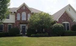 Great floor plan, location, and excellent schools! Completely upgraded kitchen with high-end cabinets and appliances is open to Family Room with beautiful brick fireplace and custom built-in bookshelves. Screened back porch and deck overlook fenced yard