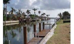 Oversized Water Direct Lot with quick access. City sewer!! Royal Palms and Dock remain. Seller will consider a trade for a condo on the beach. Close to shopping. Quick boat access to Marco River.
