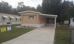 This remodeled mobile home is in an over 55 community with a canal out your back door with direct assess to Lake Rosalie and the Kissimmee Chain of Lakes, in Lake Wales, FL. It has its own laundry closet and 2 storage sheds for either a work shop and or