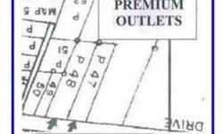 PRIME 2 Acre site of HI Zoned property at back entrance of the PREMIUM OUTLETS - Abutts the entrance road and parking lot. Currently has 2 rented homes, but being sold as land only and all improvements strictly "as-is". Call Listing Broker for more