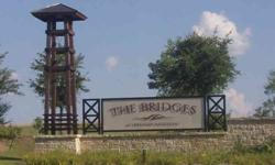 This BELOW MARKET VALUE home site is located in the Bridges of Preston Crossings subdivision, home of a Fred Couples Signature Golf Course. The back of the site is bordered by a drainage creek, preventing building directly adjacent from behind. It has