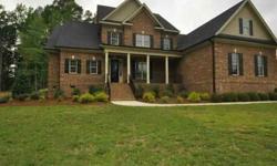 To hear a 24 hour description, call 800-983-7433 and enter #9781. Beautiful ALL brick custom home has 3 car garage, 1st floor master & guest suite. Amazing Home Theatre with wet bar, screen porch, stone fireplace, walk-in closets in all bedrooms, huge