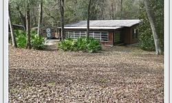2 BR/2 BA home partially furnished. The home is located in the Ocala National Forest about 1 mile from Winn Dixie on Hwy 314A. Property backs up to the forest and has a small shed and a large carport. There is a screen room on the back and a florida room