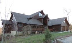 -Beautiful Log Home on 2.54 acre + another 1.38 acre lot pin #1647-43-3360. Huge finished basement area. 4 bed/3 bath + sun room w/hot tub, + loft + bonus room! Wood fireplace with one-of-a-kind 1880's Tiger Oak Mantel. 2 car attached garage with