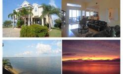 "Heaven's a little closer in a home by the sea" and you'll think you're half way there when you wake up in this exqusite home. Your rear neighbors are manatee and dolphins and the sunsets are free! Come and experience a million dollar view for a fraction