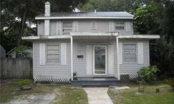 Not a short sale! Great buy on a 5 Bedroom/3 Bath quaint home on a nice, quiet tree-lined street in a Central Tampa location. Walking distance to the grocery store, restaurants, shopping. Metal roof appears to be in good condition. Well-kept dog kennels