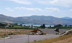 Lot 9 at Orchard View Estates is a great lot with a nice view of Lake Chelan. All of the homes here were built by Harkey Construction, one of the area's best builders. This lot has a mild slope to it and a daylight basement home has already been designed