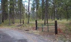 Irregular shaped 10.52 Acres at end of 2 roads. Private & secluded only 20 min. from Spokane. Nicely Treed with several buildings sites and nice view of seasonal wetlands area (lots of wildlife). Well with pump and electric with meter already installed on