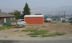 This corner lot is ideal for a duplex. 12' x 30' RV shed already on lot with storage shed.Listing originally posted at http
