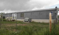 Great income potential with two mobile home rentals on over an acre. If you need a place to live and extra money you can live in one and rent out the other. The homes share well and septic and they are separately metered for electricity and propane tanks.