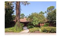 Private drive through gorgeous "Old Florida" setting, approximately 5 beautifully wooded acres with stately Oaks, Magnolias, Pines and Palmettos, to beautiful charming lakefront home with breathtaking view of Lake Hiawatha. There is approximately 285 feet