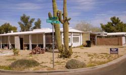 Two Bedroom on a HUGE Corner Lot! Front enclosed screened patio and back Arizona room. Roll-down security shutters on all windows and AZ room door. 3 storage sheds on property. Call or Email today to schedule a showing!