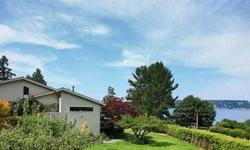Enjoy a classic Northwest Contemporary Whidbey Island waterfront perfectly situated at Sandy Point near the seaside village of Langley. Privately tucked into lovely mature landscaping with sweeping views of Saratoga Passage & the Cascades, migrating